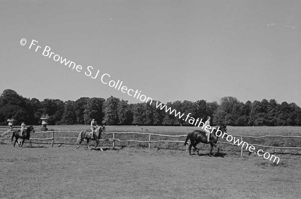 AT CASTLETOWN CHILDREN RIDING PATRICK JUMPING RIDING ON THE RING LADY CAREW & COL LEWIS JUDGING